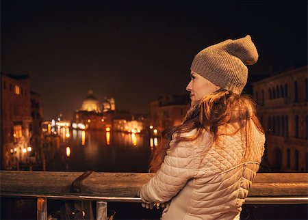 simsearch:400-08344334,k - Tune in for charming winter time in Venice, Italy. Seen from behind, young woman standing on a bridge and looking on Grand canal Stock Photo - Budget Royalty-Free & Subscription, Code: 400-08345283