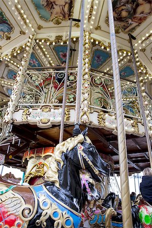 Vintage carousel or merry-go-round. Black Horse detail Stockbilder - Microstock & Abonnement, Bildnummer: 400-08345591