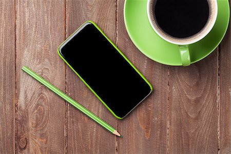 simsearch:400-08252729,k - Office wooden desk with smartphone and coffee cup. Top view Stock Photo - Budget Royalty-Free & Subscription, Code: 400-08346911