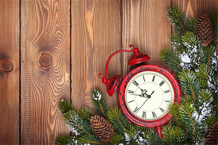 Christmas wooden background with clock, snow fir tree and copy space Stock Photo - Budget Royalty-Free & Subscription, Code: 400-08346925