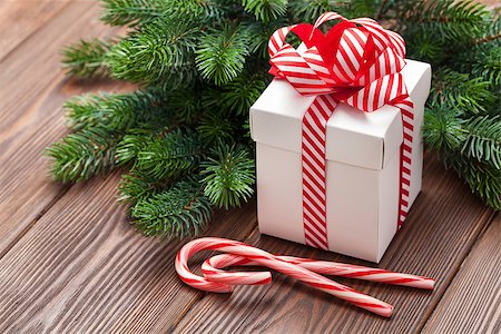 simsearch:400-04241664,k - Christmas gift box, candy cane and fir tree branch on wooden table Stock Photo - Budget Royalty-Free & Subscription, Code: 400-08346935