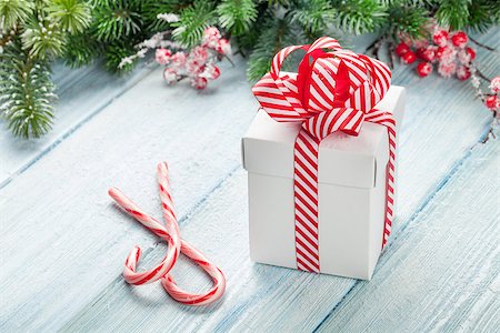 simsearch:400-04241664,k - Christmas gift box, candy cane and fir tree branch on wooden table Stock Photo - Budget Royalty-Free & Subscription, Code: 400-08346933