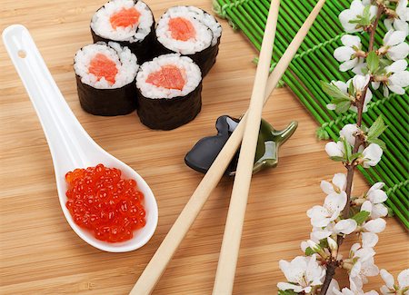 simsearch:400-08072780,k - Red caviar, sushi set, sakura branch and chopsticks over bamboo table Stockbilder - Microstock & Abonnement, Bildnummer: 400-08346964