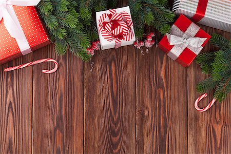 simsearch:400-04241664,k - Christmas gift boxes and fir tree branch on wooden table. Top view with copy space Stock Photo - Budget Royalty-Free & Subscription, Code: 400-08346967