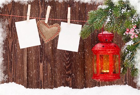 Christmas candle lantern, fir tree branch and blank photo frames Stock Photo - Budget Royalty-Free & Subscription, Code: 400-08346976