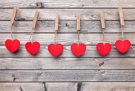 simsearch:400-08034173,k - Love concept. Hearts hanging on a string, shot on wooden background Stockbilder - Microstock & Abonnement, Bildnummer: 400-08347422