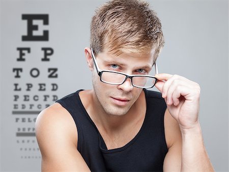 eye doctor (male) - Handsome young man wearing glasses Stock Photo - Budget Royalty-Free & Subscription, Code: 400-08341039