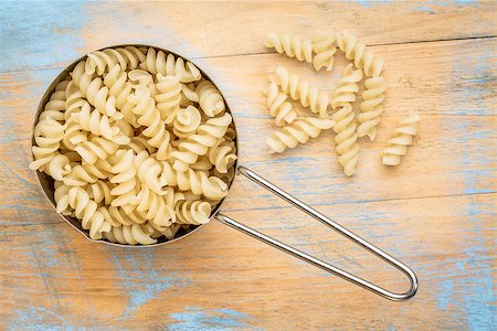 simsearch:400-08342479,k - healthy, gluten free quinoa pasta (fusilli)  - top view of a metal measuring cup against painted wood Stock Photo - Budget Royalty-Free & Subscription, Code: 400-08341080