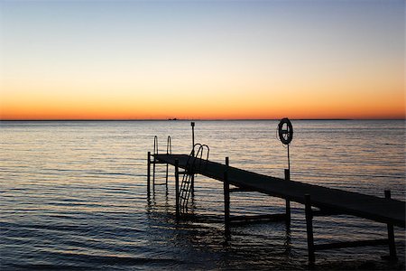 Silhouette of a bath pier by sunset at the Baltic Sea Stock Photo - Budget Royalty-Free & Subscription, Code: 400-08341352