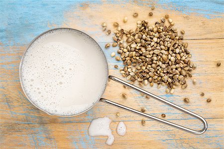 simsearch:400-08342479,k - hemp milk in measuring cup with seeds against wooden background Stock Photo - Budget Royalty-Free & Subscription, Code: 400-08341626