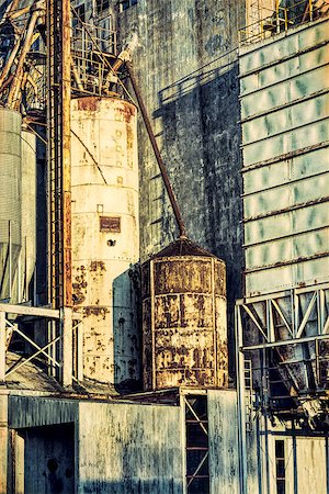 simsearch:400-07429824,k - industrial background with grunge texture effect - exterior of old abandoned grain elevator with pipes, ducts, ladders and chutes Stock Photo - Budget Royalty-Free & Subscription, Code: 400-08341633