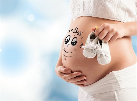 simsearch:400-08253730,k - Pregnant woman holding the shoes of baby Stock Photo - Budget Royalty-Free & Subscription, Code: 400-08341794