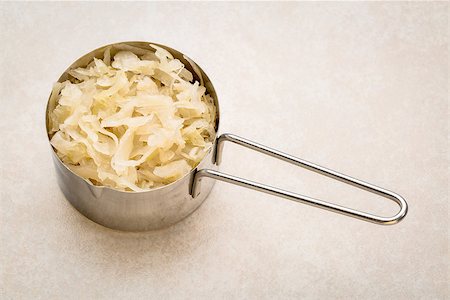 simsearch:400-08342479,k - metal measuring scoop of sauerkraut against ceramic tile - healthy eating concept (probiotic food) Stock Photo - Budget Royalty-Free & Subscription, Code: 400-08342104