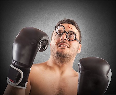 Goofy boxer with nerd eyeglasses and plasters Stock Photo - Budget Royalty-Free & Subscription, Code: 400-08342348