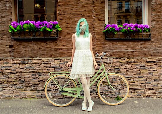 Young sexy girl in a white dress standing near a green retro bicycle Stock Photo - Royalty-Free, Artist: Glenofobiya, Image code: 400-08342550