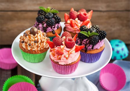 Set of different delicious cupcakes on funny cake-stand Stock Photo - Budget Royalty-Free & Subscription, Code: 400-08342655