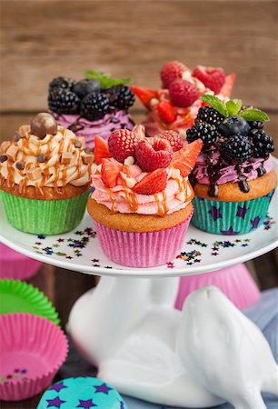Set of different delicious cupcakes on funny cake-stand Stock Photo - Budget Royalty-Free & Subscription, Code: 400-08342657