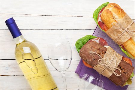 simsearch:400-07937807,k - Two sandwiches and white wine on wooden table. Top view with copy space Photographie de stock - Aubaine LD & Abonnement, Code: 400-08343131