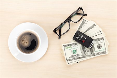 simsearch:400-07915276,k - Money cash, glasses, car remote and coffee cup on wooden table Photographie de stock - Aubaine LD & Abonnement, Code: 400-08343207