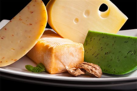 emmentaler cheese - Colorful culinary cheese variation on black background. Gourmet cheese eating, modern minimal contemporary style. Stock Photo - Budget Royalty-Free & Subscription, Code: 400-08343446