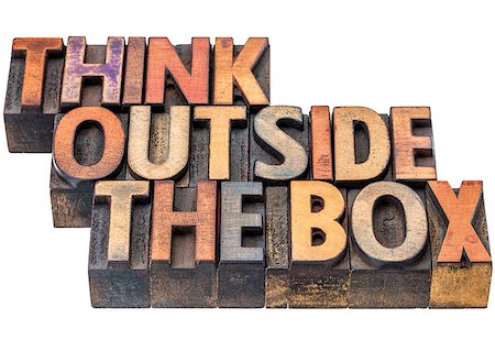 different concept - think outside the box - motivational phrase in vintage letterpress wood type, stained by ink, isolated on white Stock Photo - Budget Royalty-Free & Subscription, Code: 400-08343539