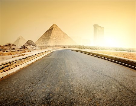 simsearch:400-09222068,k - Asphalted road to piramids and modern buildings of Giza Stock Photo - Budget Royalty-Free & Subscription, Code: 400-08343795