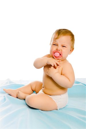 pzromashka (artist) - upset baby in diapers on a blue coverlet. Studio Foto de stock - Royalty-Free Super Valor e Assinatura, Número: 400-08374021