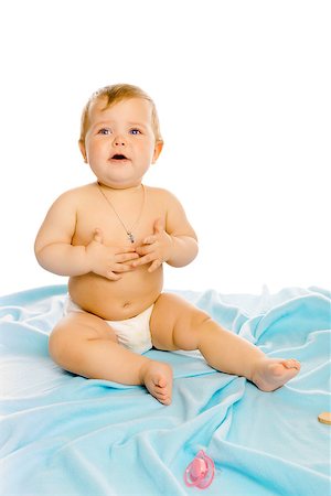 pzromashka (artist) - upset baby in diapers on a blue coverlet. Studio Foto de stock - Royalty-Free Super Valor e Assinatura, Número: 400-08374022