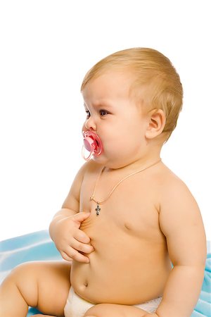 pzromashka (artist) - upset baby in diapers on a blue coverlet. Studio Foto de stock - Royalty-Free Super Valor e Assinatura, Número: 400-08374023