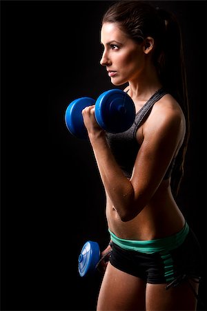 skin tone - pretty caucasian fitness woman on black isolated background Stock Photo - Budget Royalty-Free & Subscription, Code: 400-08375614