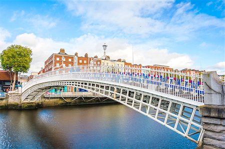 View of Hapenny Bridge over Liffey river in Dublin, Ireland Stock Photo - Budget Royalty-Free & Subscription, Code: 400-08376573
