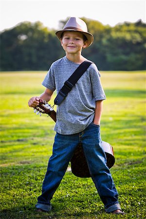 simsearch:400-05248187,k - cuacasian boy with guitar in the park outdoors Photographie de stock - Aubaine LD & Abonnement, Code: 400-08376956