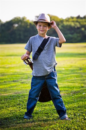 simsearch:400-05248187,k - cuacasian boy with guitar in the park outdoors Photographie de stock - Aubaine LD & Abonnement, Code: 400-08376957