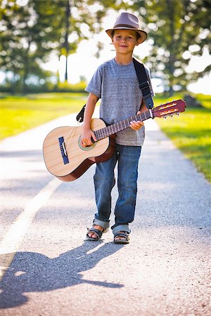 simsearch:400-05248187,k - cuacasian boy with guitar in the park outdoors Photographie de stock - Aubaine LD & Abonnement, Code: 400-08376958