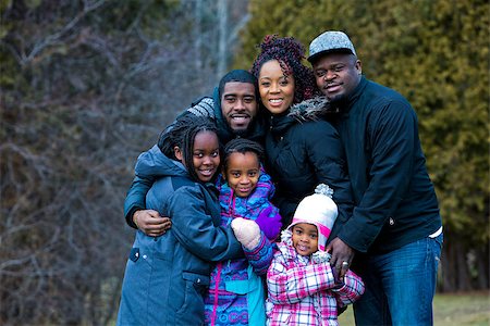 simsearch:695-05773921,k - casual winter young black family outdoors in the park Photographie de stock - Aubaine LD & Abonnement, Code: 400-08376999