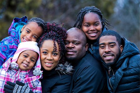 simsearch:695-05773921,k - casual winter young black family outdoors in the park Photographie de stock - Aubaine LD & Abonnement, Code: 400-08377005