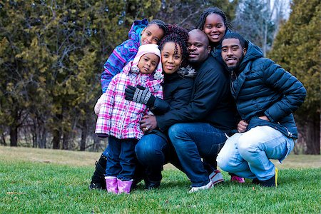 simsearch:695-05773921,k - casual winter young black family outdoors in the park Photographie de stock - Aubaine LD & Abonnement, Code: 400-08377006
