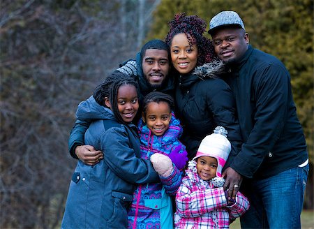 simsearch:695-05773921,k - casual winter young black family outdoors in the park Photographie de stock - Aubaine LD & Abonnement, Code: 400-08377000