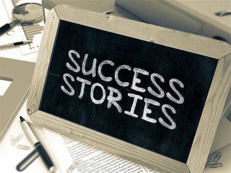 simsearch:400-08891463,k - Handwritten Success Stories on a Chalkboard. Composition with Chalkboard and Ring Binders, Office Supplies, Reports on Blurred Background. Toned Image. Foto de stock - Super Valor sin royalties y Suscripción, Código: 400-08378031