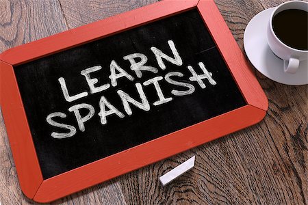 Learn Spanish Concept Hand Drawn on Red Chalkboard on Wooden Table. Business Background. Top View. Stock Photo - Budget Royalty-Free & Subscription, Code: 400-08378057