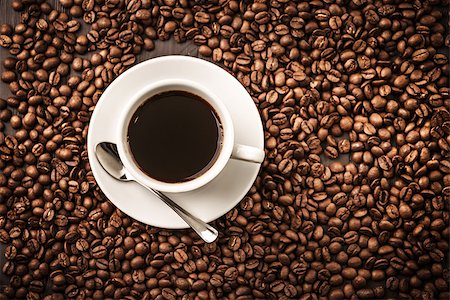 Coffee cup top view on beans background with spoon Stock Photo - Budget Royalty-Free & Subscription, Code: 400-08379235