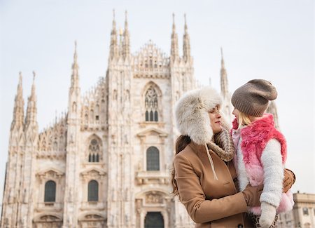 simsearch:400-08341864,k - Why not to hang out in Italian fashion capital Milan on winter holidays with family. Mother and daughter in front of Duomo spending fun time sightseeing Milan Fotografie stock - Microstock e Abbonamento, Codice: 400-08379453