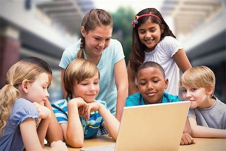 Composite image of cute pupils using tablet computer in library Stock Photo - Budget Royalty-Free & Subscription, Code: 400-08379725