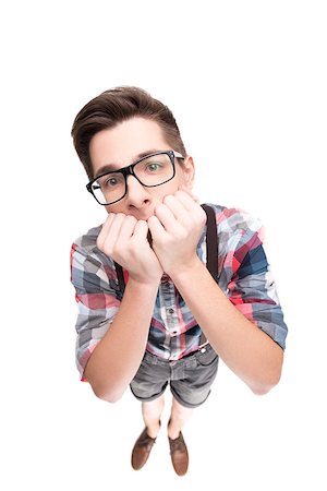 simsearch:400-06561343,k - Stressed boy with eyeglasses biting fingernails, isolated on white background Stock Photo - Budget Royalty-Free & Subscription, Code: 400-08370330