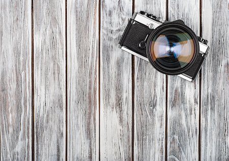 Vintage camera on wooden background Stock Photo - Budget Royalty-Free & Subscription, Code: 400-08370977