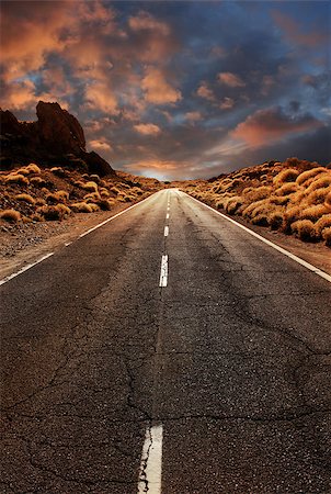 simsearch:400-07570603,k - Grungy asphalt road leading through desert sunset landscape Stock Photo - Budget Royalty-Free & Subscription, Code: 400-08371001