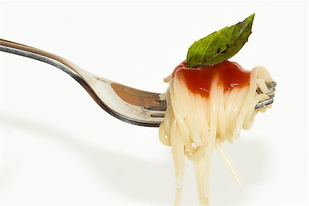 Pasta with sauce on the fork isolated on white Stock Photo - Budget Royalty-Free & Subscription, Code: 400-08371300