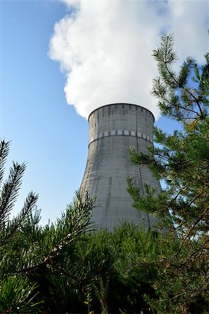 Nuclear power plant, industry and energy among pine woods Stock Photo - Budget Royalty-Free & Subscription, Code: 400-08371324