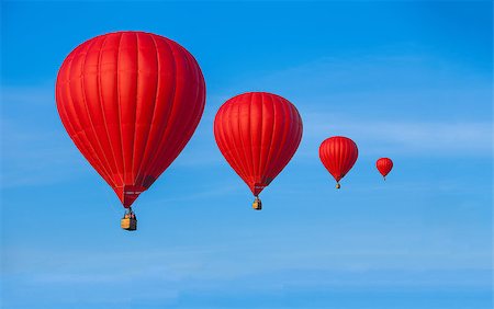 simsearch:400-09090841,k - Four Red hot air balloons in blue sky with white clouds Stock Photo - Budget Royalty-Free & Subscription, Code: 400-08371701