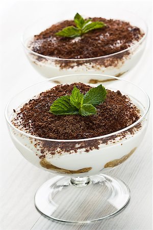 Delicious tiramisu sweet cream cheese desert in glass Fotografie stock - Microstock e Abbonamento, Codice: 400-08371863